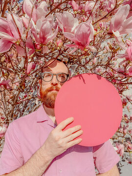 Man poses with circle