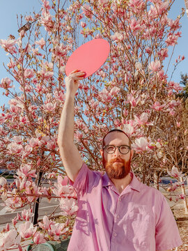 Man poses with circle
