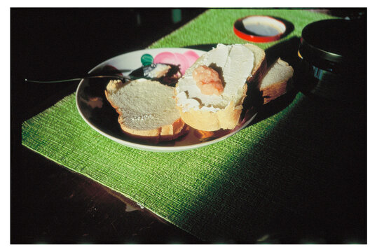 Bread and caviar on a plate in a bright kitchen setting