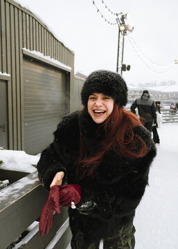 Woman laughing on a skating rink