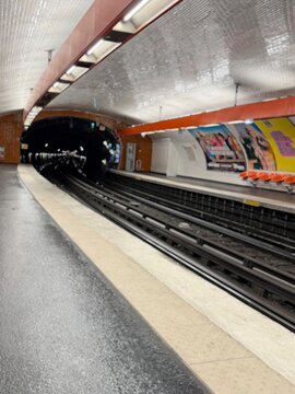 Empty metro platform with tiled curved ceiling