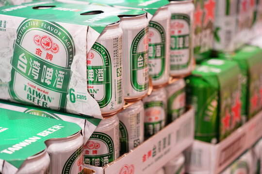 Packs of local Taiwan Beer displayed on supermarket shelves.