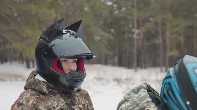 Closeup rider black helmet focused eyes in snowy forest, portrait shows steady gaze and quiet determination, navigator mindset shifts to competitor mode, visor fog checked, breath visible in cold