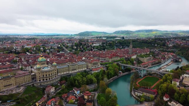 Aerial: Bern old town, Church of St. Peter and Paul and Federal Palace of Switzerland, pan drone shot