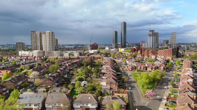 Drone flying over Acton in West London. Leafy green English urban city