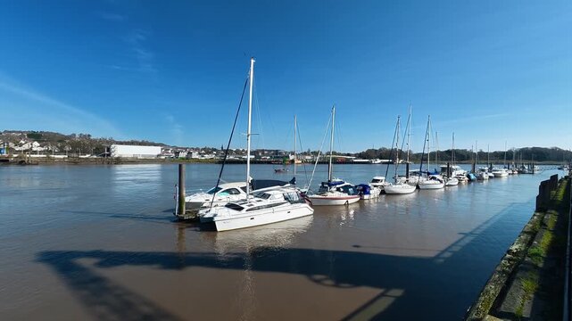 Suir River view in Waterford City Ireland boats moored in marina on a bright spring morning