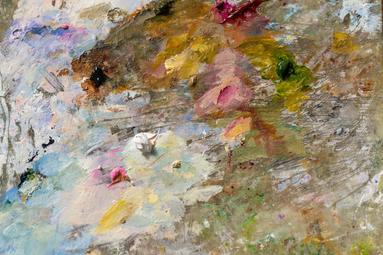 Rich textured artwork. Closeup of layered pigment. Impasto method creates rustic textured effects. Painting emphasizes granular texture with thick pigment layers and residue