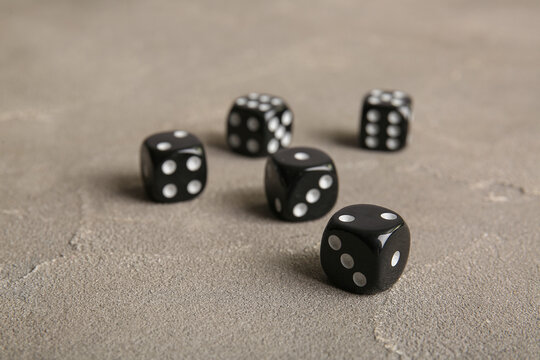 Black dices on grey background