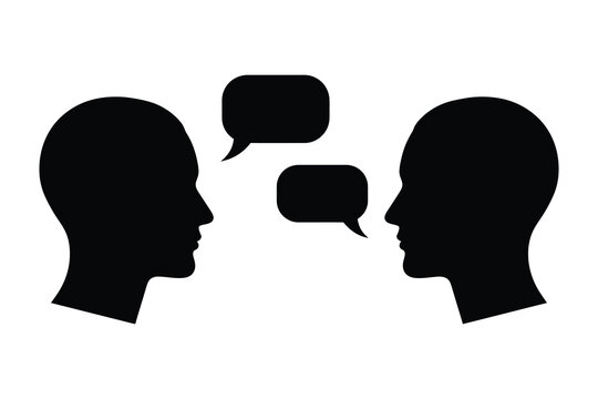 Communication concept two silhouetted heads with speech bubbles representing dialogue and interaction