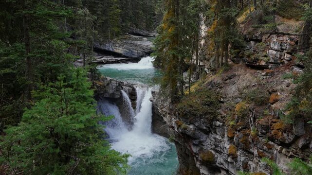 Johnston Canyon Upper Falls flowing in Jasper National Park