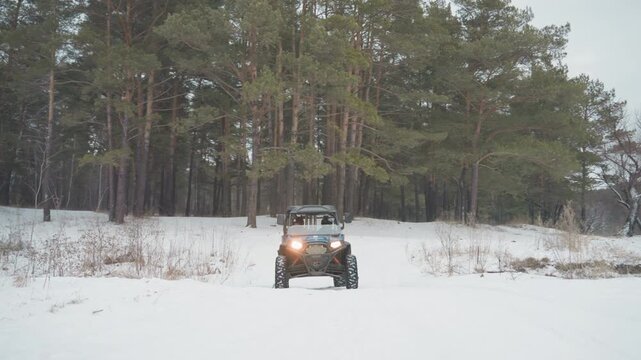 Atv charging toward camera across snow, headlights blazing with sunset glow, driver piloting rugged offroad buggy, signpost checkpoint visible, dynamic momentum and urgent adventurous tone