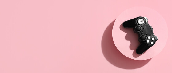 Modern joystick on pink background © Pixel-Shot