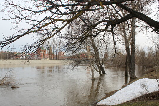 Spring flood with a river overflowing its banks.