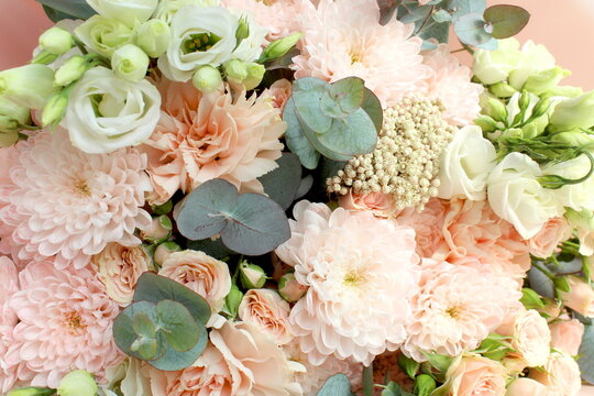 A bouquet of delicate flowers of a soft pink color.