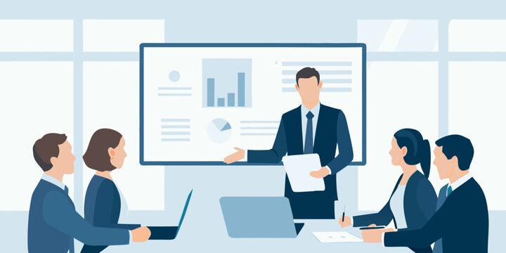 A businessman presents data analysis to colleagues in a meeting room