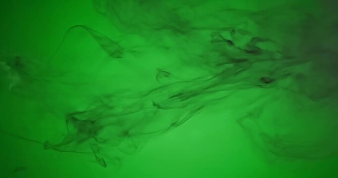 Green background with smoke effect.