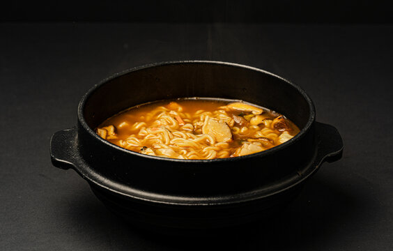 Steaming Spicy Ramen in Black Bowl