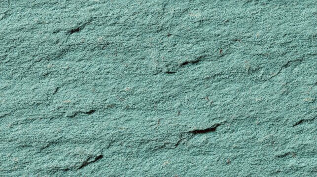 Close-up image of a textured, rough, turquoise stone surface with natural cracks and irregularities, texture green background