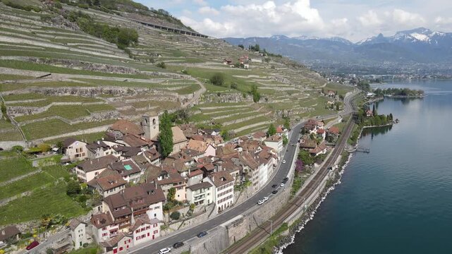 Aerial drone view of Lavaux vineyards with lakeside road and Lake Geneva Switzerland