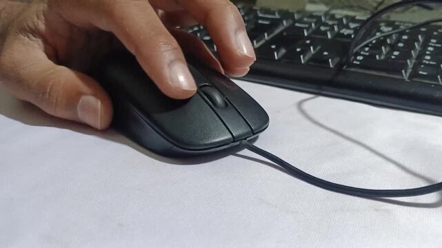 Close up of Finger Clicking Computer Mouse Buttons