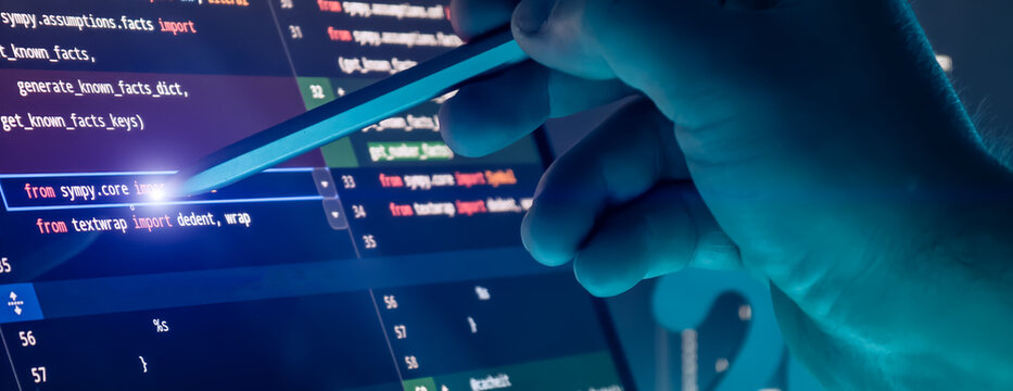 Close Up of Programmer Hand Using Stylus on Source Code Editor Screen in Futuristic Blue Tech Interface