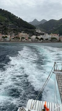Ferry departing from the pier of Maiori with views of the Amalfi Coast, Salerno, Campania, Italy