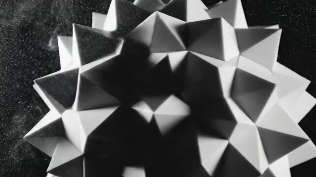 Abstract three dimensional geometric crystal sphere object with vapor effect against a dark background