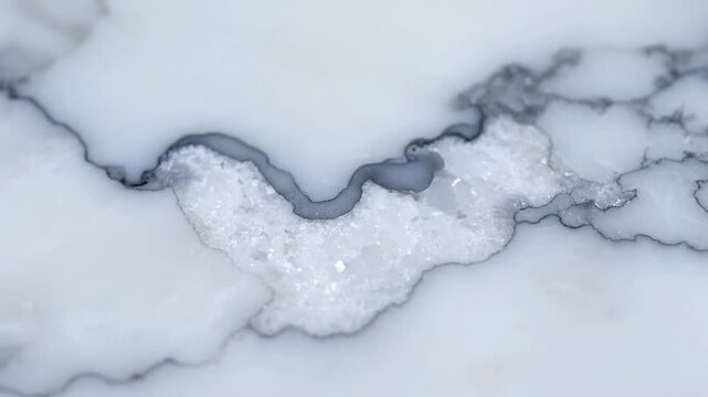 Close up of white marble texture with gray veins and crystalline inclusions, natural stone surface, abstract mineral pattern
