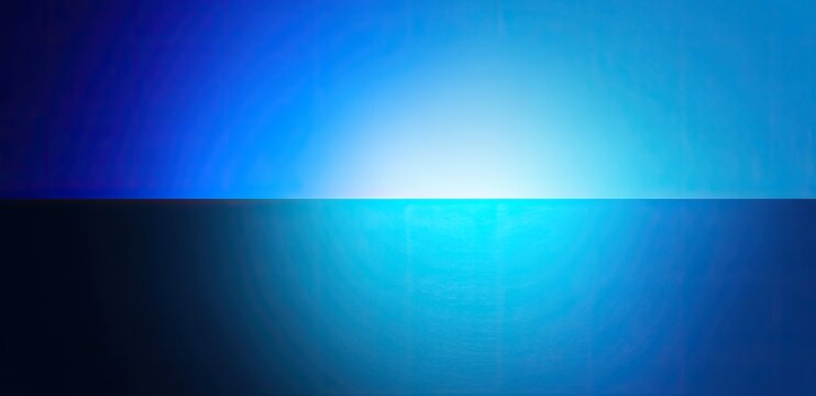 Abstract blue and white light gradient divided horizontally, reflecting