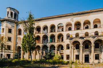 Naklejka premium Abandoned Sanatorium Iveria in Tskaltubo, Georgia — Soviet-era architecture reclaimed by nature and time