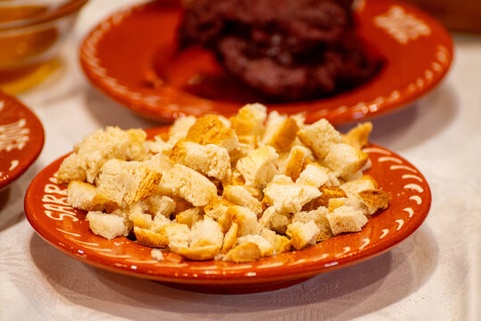 Portuguese migas served on a traditional ceramic plate The Concept of comfort food