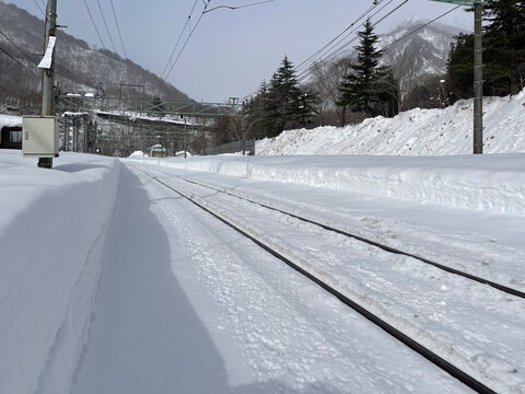 Snow covered train tracks at a station in Northern Japan