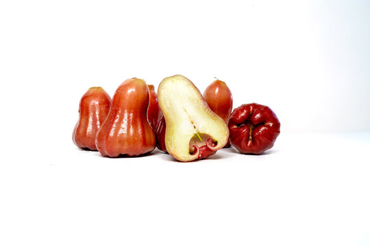Fresh 5 red wax apples with sliced fruit isolated on white background