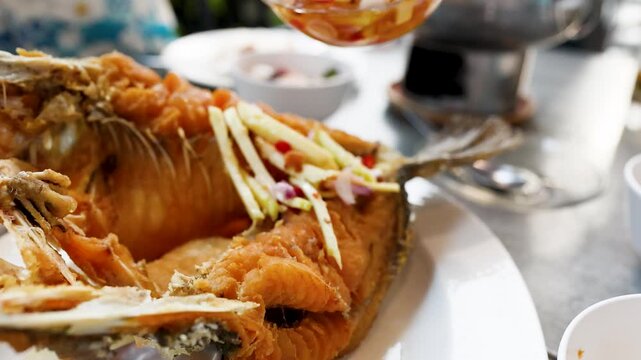 Thai Crispy Fried Sea Bass Served with Mango Salad and Sauce