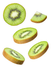 Fototapeta premium Fresh kiwi fruit pieces, including full slices, halves, and quarters.