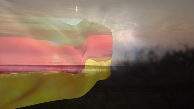 Sunset breeze starting, translucent striped fabric billowing and folding, blending sun and shore