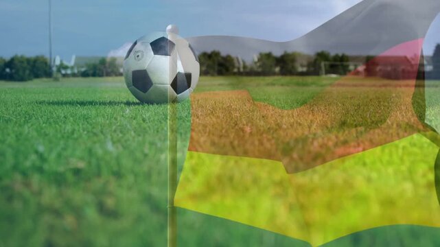 Breeze starting, soccer ball resting beside corner flag, sheer flag waving, showing corner setup