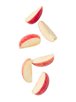 Dynamic composition of fresh red apple slices, artfully arranged, showcasing natural beauty.