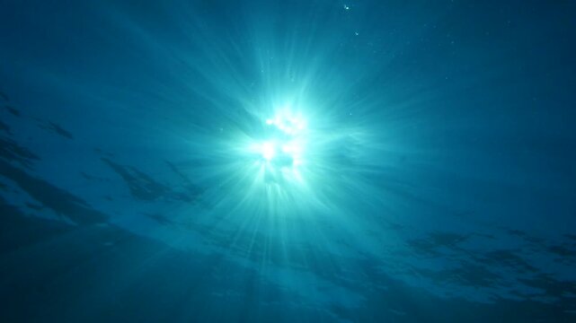 sun ray and sun beam scenery underwater waves on surface of water slow ocean scenery for background
