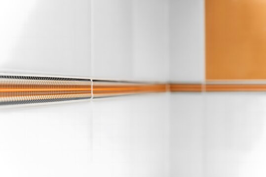 Abstract Interior Detail with Orange and White Lines and Reflections Keywords: abstract, interior, detail, lines, orange, white, reflections
