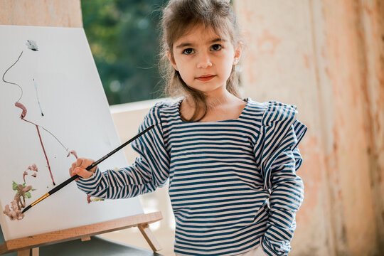 portrait of a young girl painting