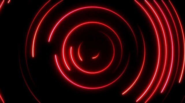 Red neon circles rotating on a black background for futuristic abstract motion graphics.