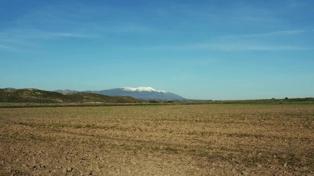 Across ploughed fields to the snow topped Moncayo massif in Spain.