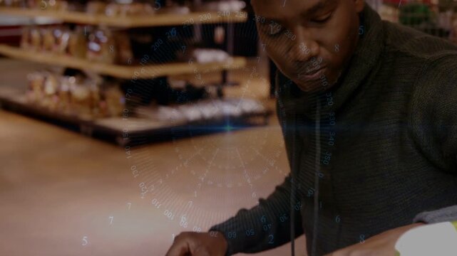 Male shopper reaching lifting yellow tub in retail causing animated zoom marking label for reading