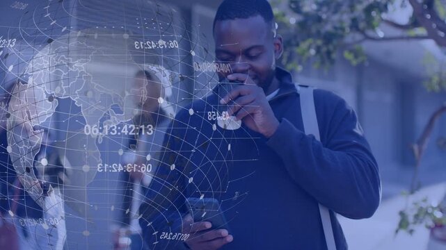 Adult man standing by door scrolling phone sipping coffee causing holo rotating showing tech data