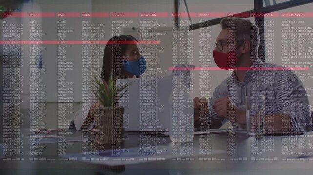Woman and man reviewing business data on laptop, gesturing as red bar flashing and code scrolling