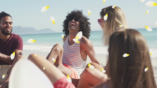 Center man touching lip after banter laughing group joining beach petals drifting over them travel