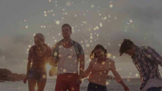Friends walking shore, sparkles appearing and drifting over group, accenting waves for marketing