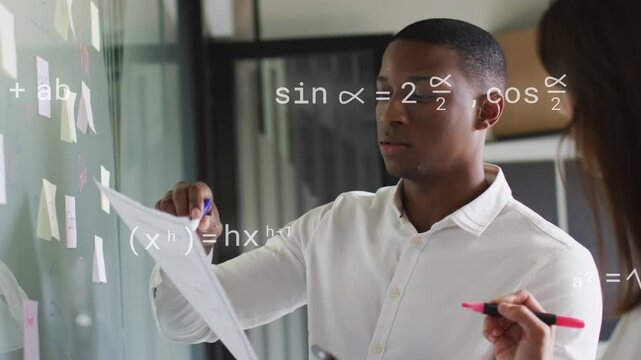 Man checking pages, woman annotating glass while animated formulas marking notes for business plans