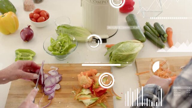 Woman slicing onion, man opening compost pail and moving scraps, HUD tracking food prep